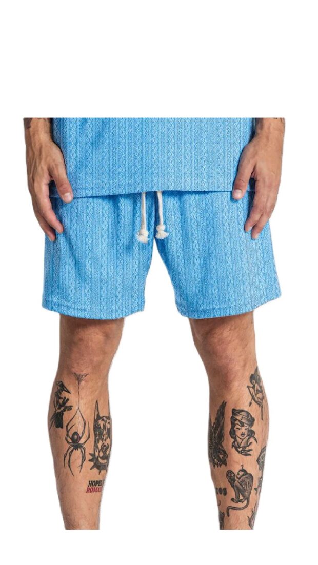 Pantalón corto holgado con grabado de cenefas en el tejido